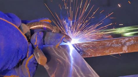 Metal Welding With Sparks And Smoke Worker With Protective Mask Welding Metal Welder Joins