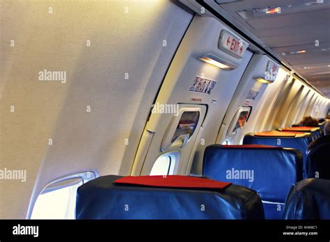 Passenger Seat Interior Of Airplane With Passengers Sitting On Seats Stock Photo Alamy