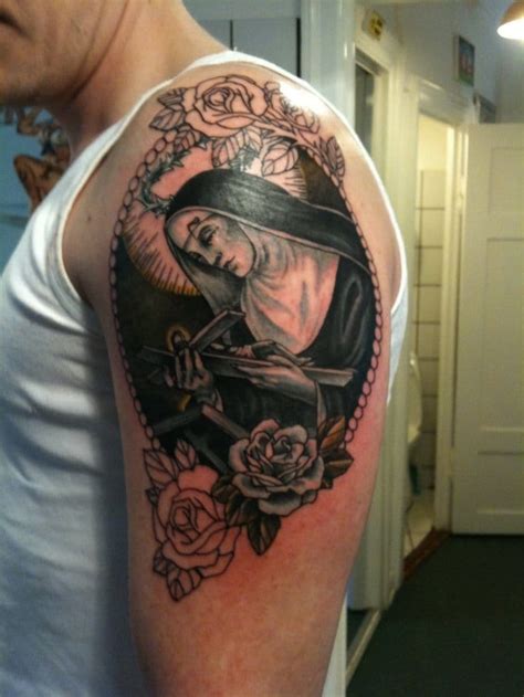 Black and grey religious tattoos are very popular just now, this one was pretty different from the usual angels and doves. 10 Timeless Saint Tattoos | Tattoodo