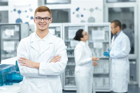 Cheerful Chemist Posing Proudly At The Laboratory Connecticut Area