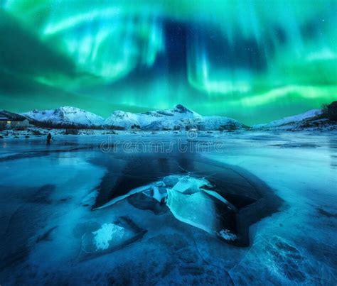 Northern Lights Over Snowy Mountains Frozen Sea Coast Stock Image
