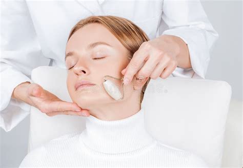 Beautiful Woman Having Face Treatment Cosmetologist Massaging Chin