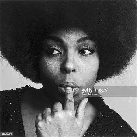 Studio Headshot Portrait Of American Pop Singer Roberta Flack Holding