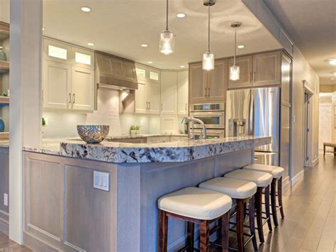 Shaker kitchen cabinets are paired with black countertops and a blue glass tile backsplash laid out in brick pattern alongside an. Lighting Pendant Lights Above Kitchen Island Glass Pendant ...