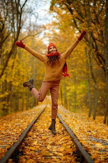 Premium Photo Portrait Of Happy Overjoyed Woman In Jump Over Railroad