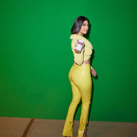 Kourtney Kardashian Shows Off Her Butt In Tight Latex Yellow Pants And Bare Stomach In Crop Top