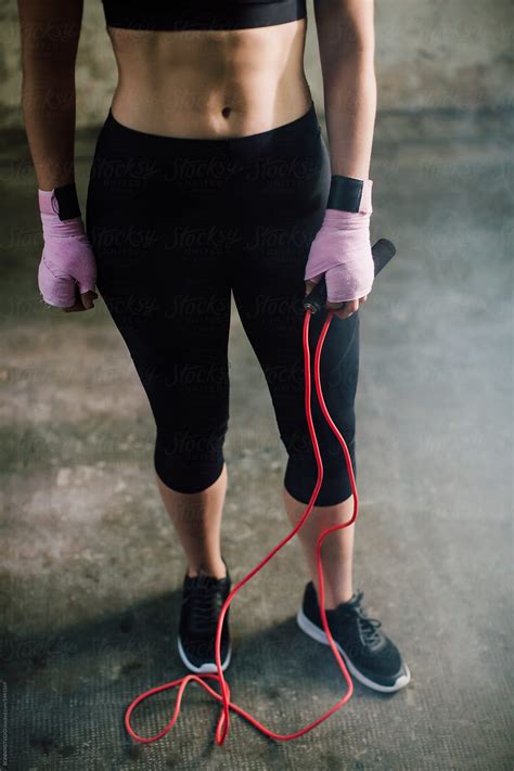 Strong Brunette Woman Jumping Rope By Stocksy Contributor Bonninstudio Stocksy
