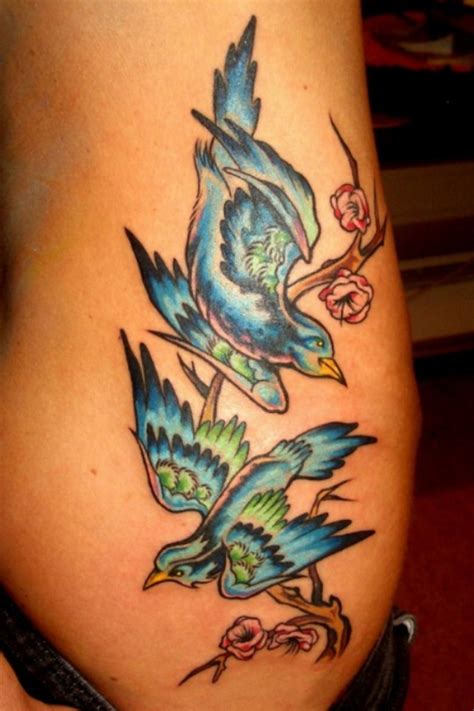 Two Colorful Beautiful Doves Hip Tattoo Designs Hip Tattoo Rib Tattoos For Women