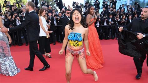 Topless Screaming Protester Removed From Cannes Red Carpet Photos