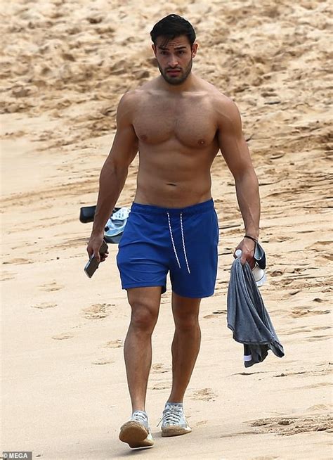britney spears beau sam asghari shows off his muscles during a relaxing solo beach stroll in