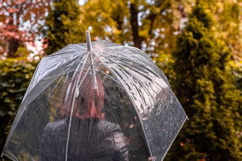 Autumn Lonely Sad Woman Under A Transparent Umbrella With Rain Drops
