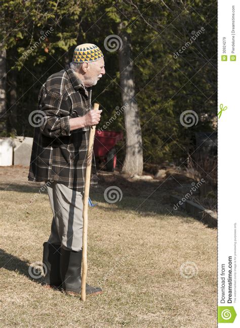 Old Man Walking On The Garden Royalty Free Stock Images