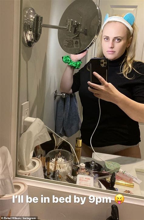 rebel wilson poses for a bathroom selfie in a t shirt and underwear after almost 5st weight loss