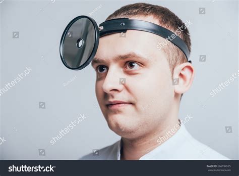 Medical Frontal Reflector On Doctors Head Stock Photo 666194575