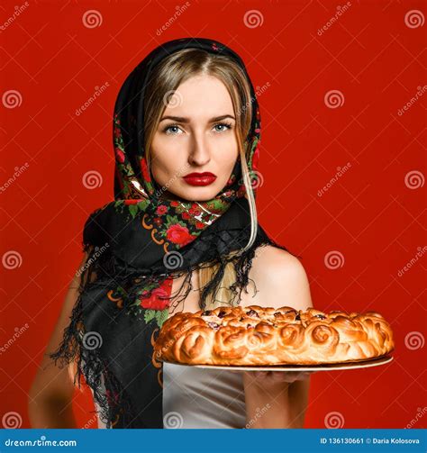 Portrait Of A Young Beautiful Blonde In Headscarf Holding A Delicious Homemade Cherry Pie Stock