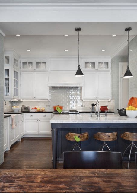 You can nod toward the current trend without having to paint all of the cabinets Dark gray island. White cabinets in background. | Kitchen ...
