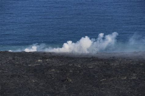 Helicopter Aerial View Of Lava Entering The Ocean And Steam Big Island