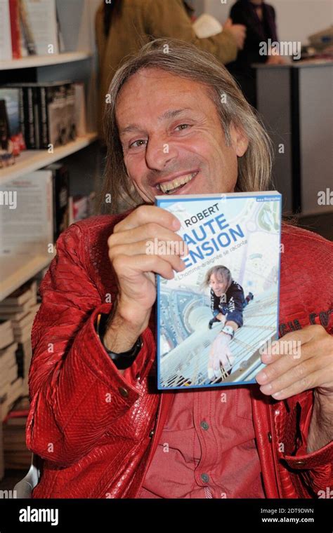 Alain Robert Signs Copies Of His Book During The 34th Salon Du Livre De