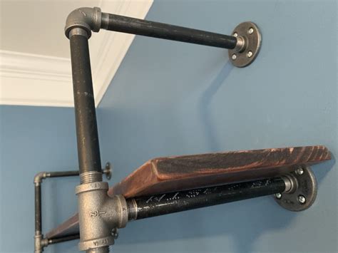 When installing a shelf unit in your space, you can attach it to a wall. Black Iron Pipe Shelves - Happiness You and Me
