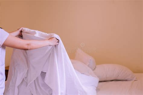 Make A Bedclose Up Of Hands Woman Making Her Bed In Bedroom After Wake Up In The Morning Stock