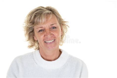 portrait of pretty blond cute mature woman confident smiling on white background stock image