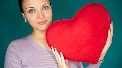 A Portrait Of A Woman Giving Love Holding A Big Red Heart Stock Photo