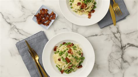 This angel hair pasta recipe is tender noodles coated in garlic, fresh herbs, olive oil, butter and parmesan cheese and topped with tomatoes. Video: Fresh Angel-Hair Pasta with Bacon and Peas Video ...