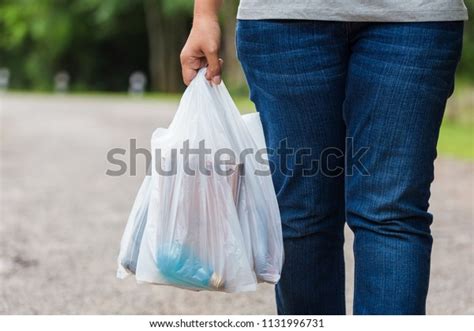 Woman Hold Plastic Bags Walk On Stock Photo Edit Now 1131996731