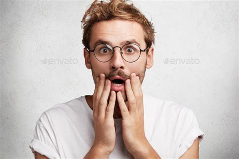 Shocked Stupefied Male Model Has Trendy Hairstyle Mustache And Stubble