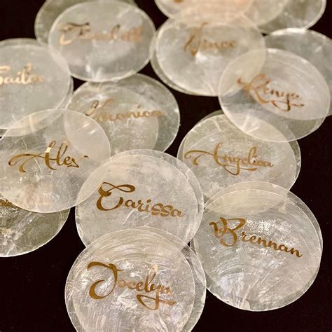 These Rose Gold Capiz Shells Will Act As Name Cards For A Modern