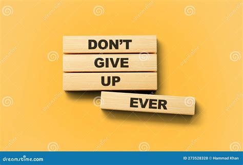 Do Not Give Up Ever Text On Wooden Blocks Isolated On Light Orange
