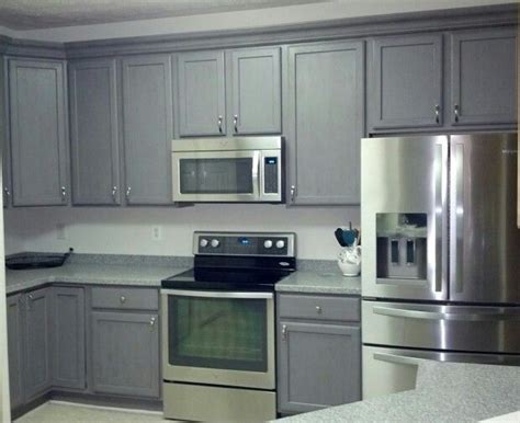 Rustoleum cabinet transformations is a cabinet coating paint and primer blend that is available in a variety of colors. Federal Grey lightly distressed with Rustoleum Cabinet ...