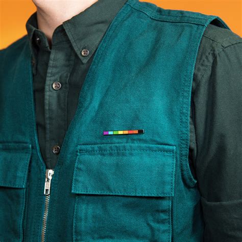 the rainbow rod enamel pin