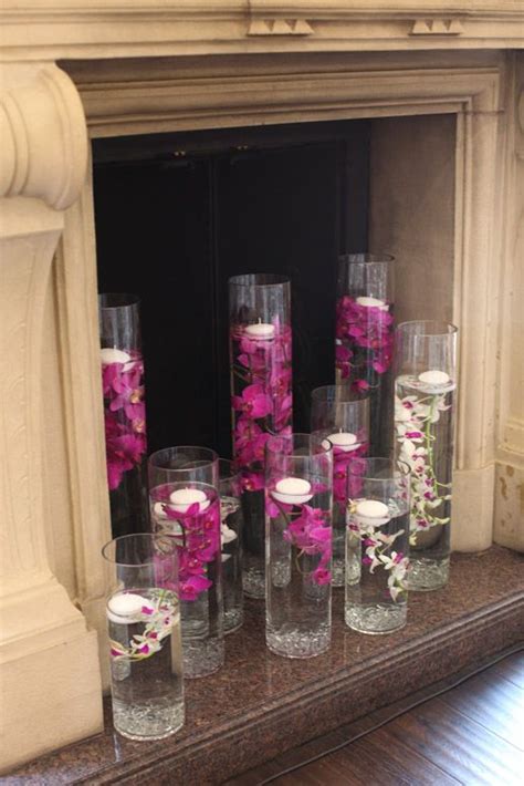Floating Candles And Purple Orchids In Tall Cylinder Vases For Summer Aspen Anniversary Party