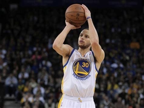 Stephen Curry For The Golden State Warriors Performing Basketball Jump
