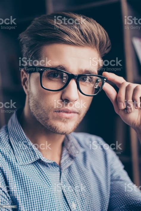 A Portrait Of Handsome Confident Guy In Checkered Shirt Touching His