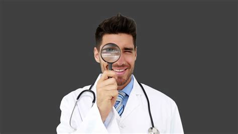 Young Doctor Looking Through Magnifying Stock Footage Video 100