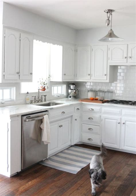 The use of white in the kitchen is a great way to keep the room feeling bright and open, even in a small space. We did it! Our kitchen remodel