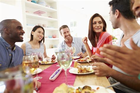 Group Of Friends Sitting Around Table Having Dinner Party Little Rock Cosmetic Surgery
