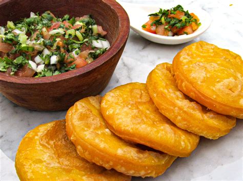 Chilean sopaipillas with pumpkin are eat by itself or on a sweet version with brown sugar. Sopaipillas con Pebre - Fran Sotomayor