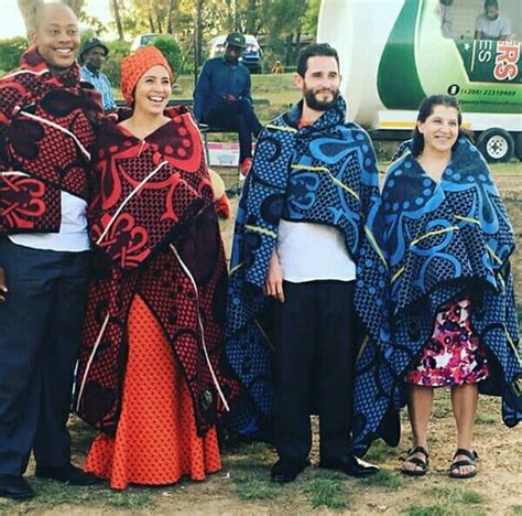 clipkulture basotho couple in traditional wedding seana blanket shweshwe dress and kobo hat