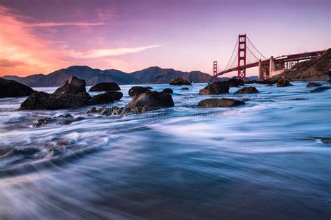 A Time Lapse Shot Of The Golden Gate Bridge Over Water In San Francisco