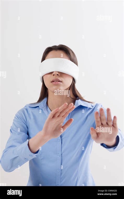 Studio Shot Of Woman Wearing Blindfold Stock Photo Alamy