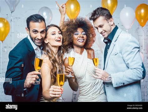 Group Of Party People Celebrating With Drinks A Birthday Or New Years