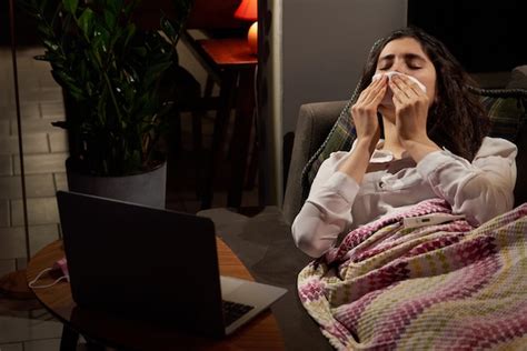 Premium Photo Young Woman On Sofa Covered With A Blanket Freezing