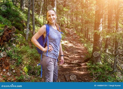 Young Smiling Woman With Backpack Hiking In Forest Stock Image Image