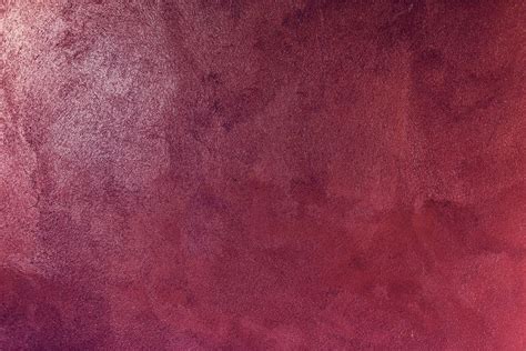 A Red And Purple Wall With Some Stains On It