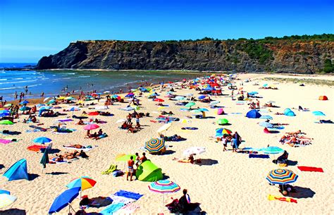 Free Photo Summer Beach Goers People At The Beach Algarve Sunbeds