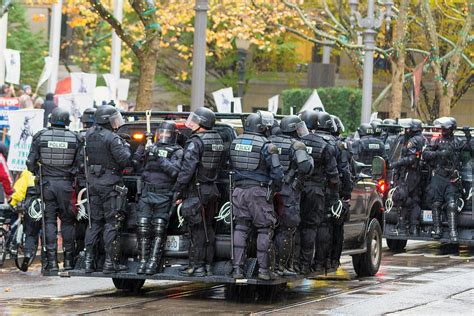 Riot Police On Vehicle To Control Occupy Portland Protest Crowd