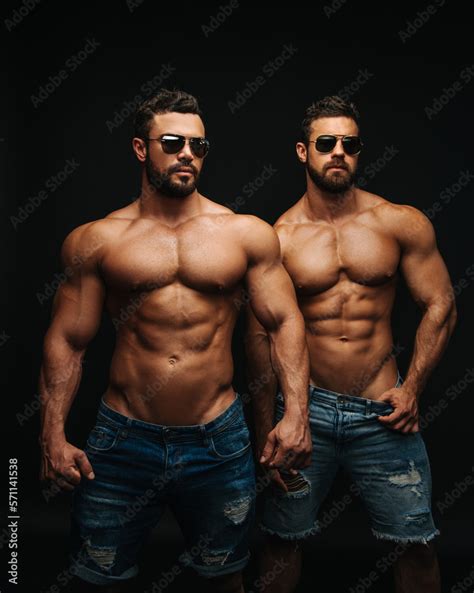 Two Shirtless Hunks At Black Background Fitness Models Couple In Jeans